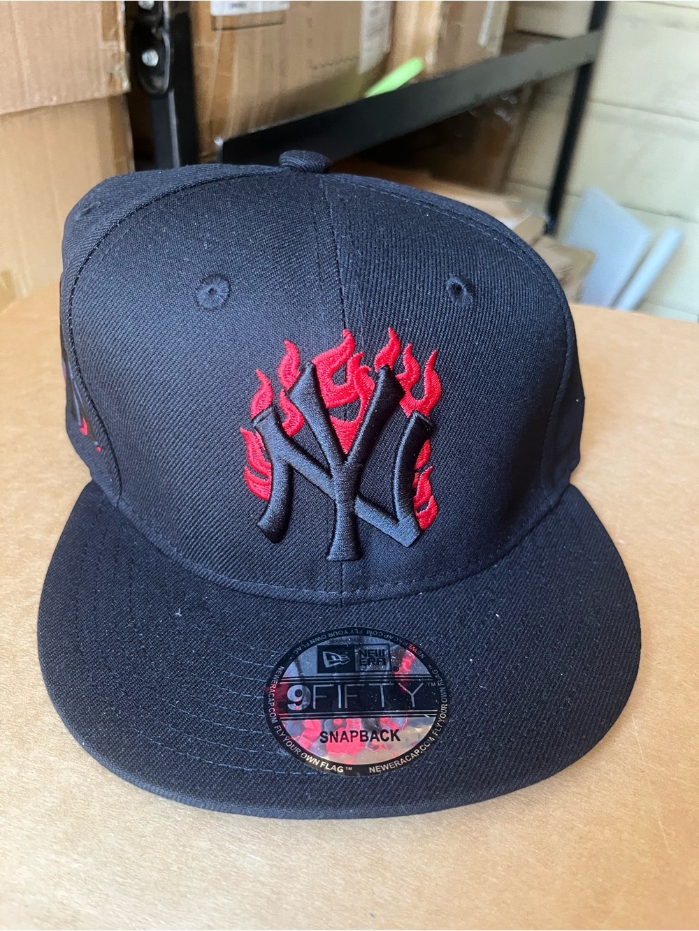 New Era Black Snapback Hat with Red Flame NY Logo
